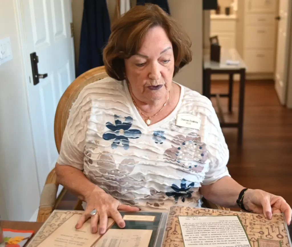 Dianne DeMille of Fullerton looks through a scrapbook she created...