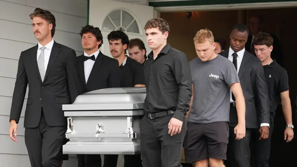 Pallbearers carry a casket containing the remains of Glenwood “Bubba”...