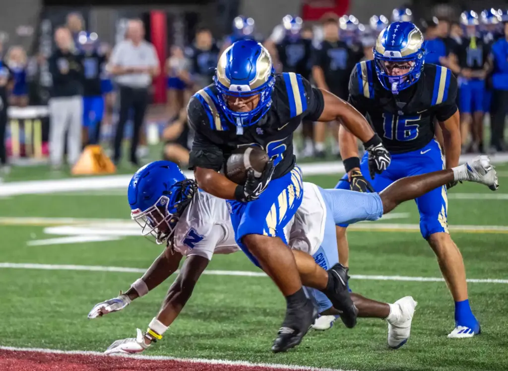 Santa Margarita running back Adrian Petero (26) carries the ball...