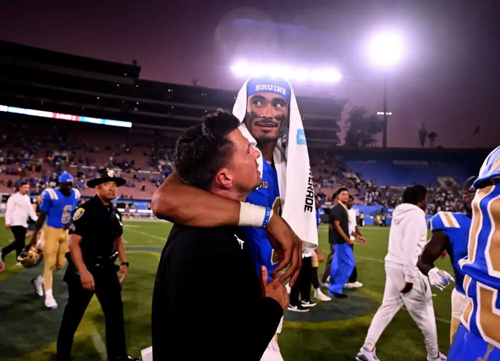 Head coach Bob Chesney with quarterback Nico Iamaleava (9) of...