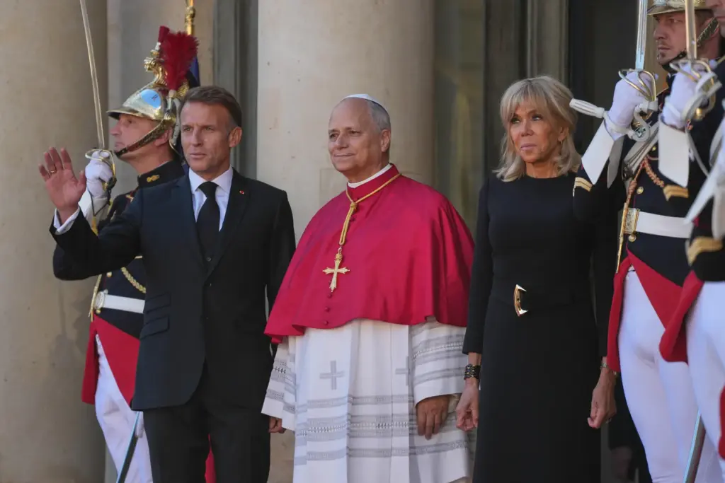 Pope Leo XIV is welcomed by French President Emmanuel Macron and his wife, Brigitte.