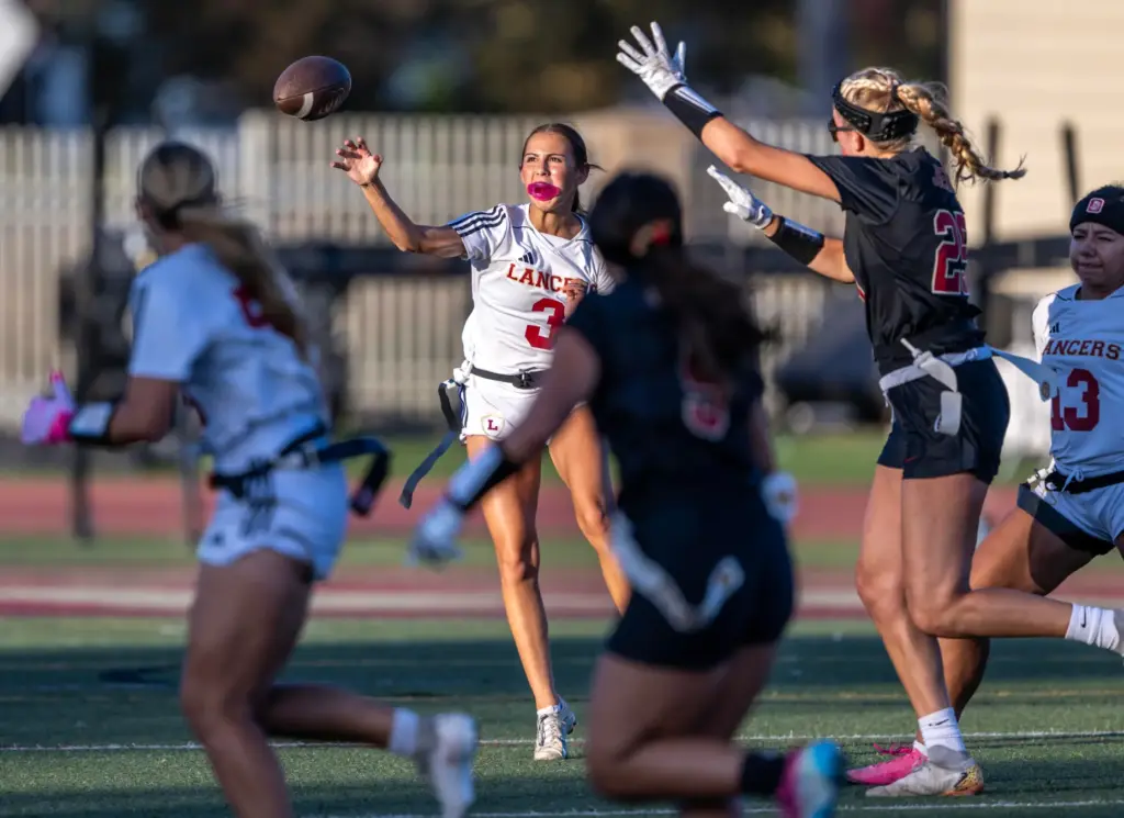 Orange Lutheran quarterback Alyssa McClure (3) throws the ball during...