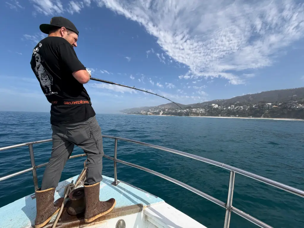 John Blum of Irvine reels in a yellowtail just a...