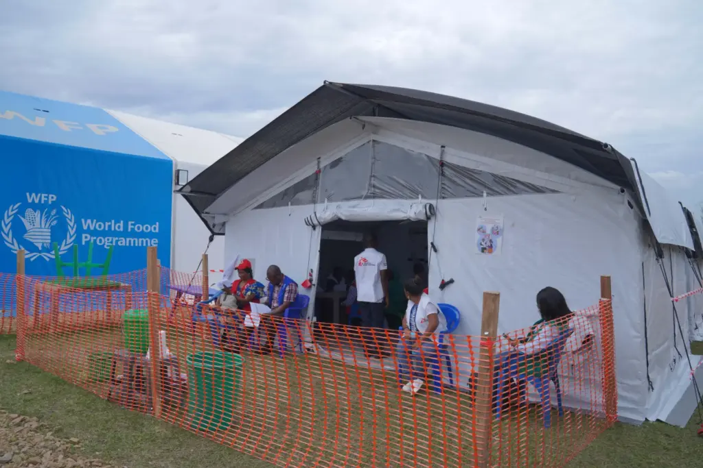 Healthcare workers wait to receive their vaccine at an Ebola...