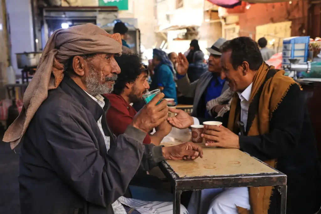 People chat at a coffee shop in Sanaa, Yemen.