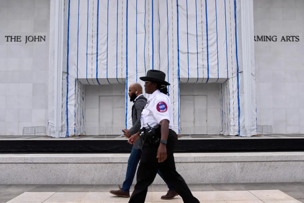 Security patrols the Kennedy Center, which has been fenced off...