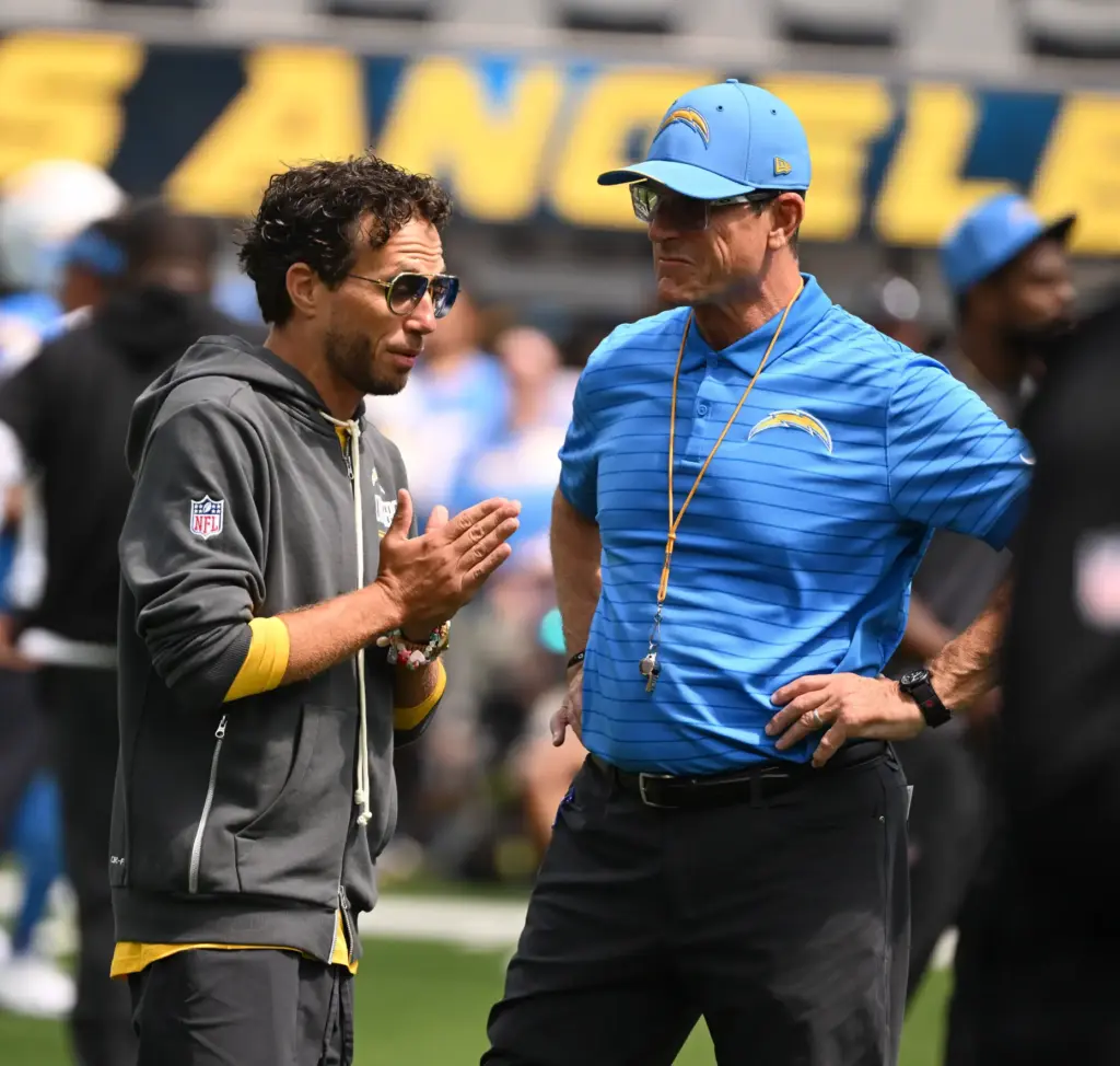 Chargers offensive coordinator Mike McDaniel, left, with head coach Jim...