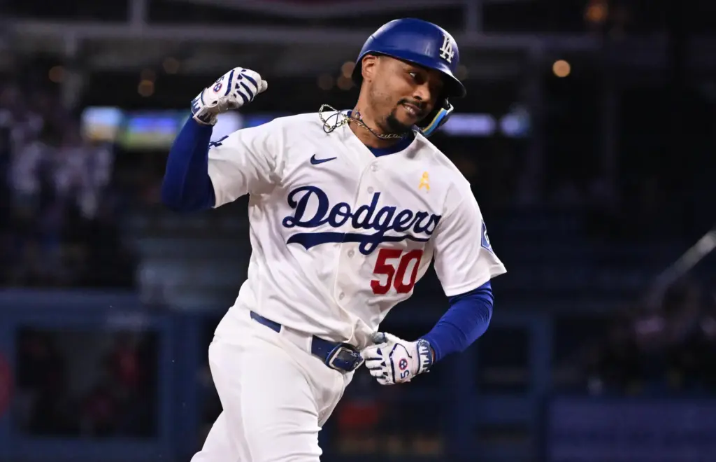 Dodgers shortstop Mookie Betts celebrates hitting a three-run home run...
