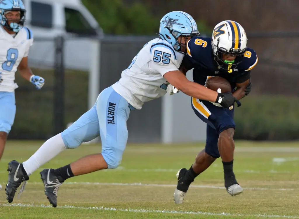 North Torrance’s Rocco Sandoval runs down Mary Star’s Myles Miller...