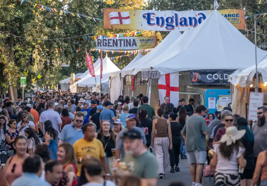Thousands of fairgoers fill Glassell Street in Downtown Orange as...