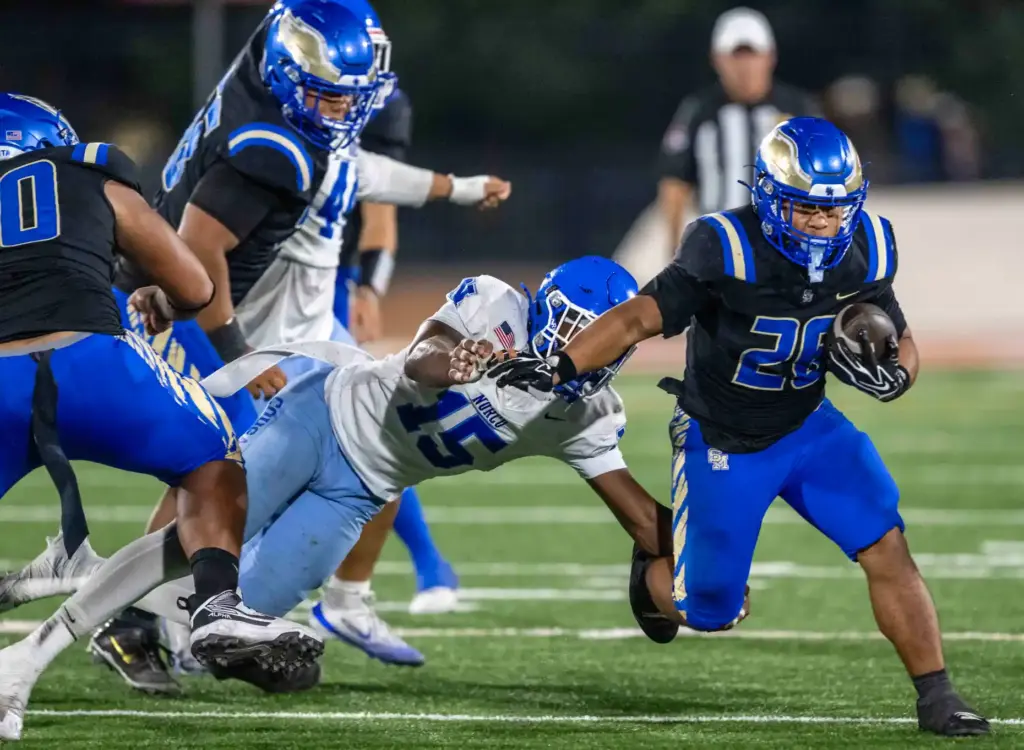 Santa Margarita running back Adrian Petero (26) carries the ball...