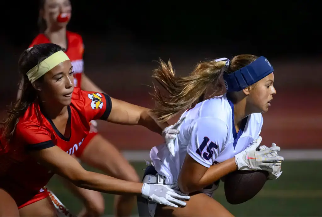 Beckman wide receiver Giselle Looney, right, holds on to a...