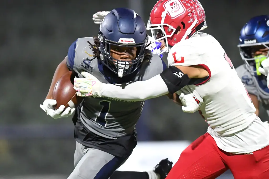 Sierra Canyonâs Sir Homer King Webb is tackled by Orange...