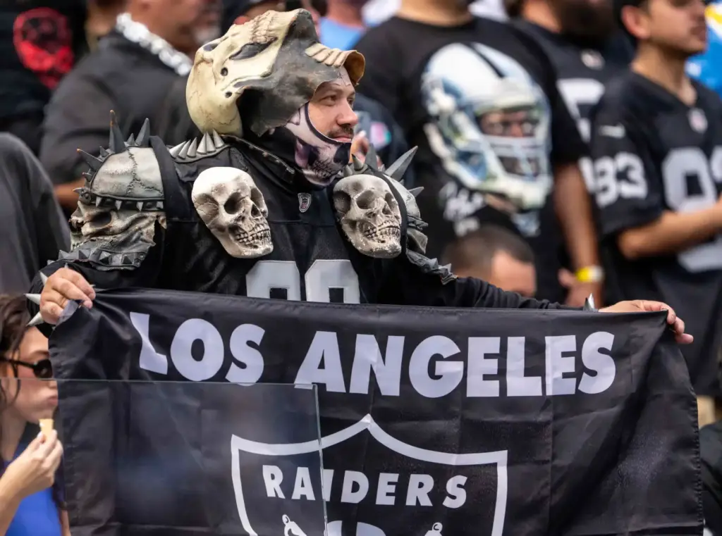 A Las Vegas Raiders fan holds a vintage âLos Angeles...