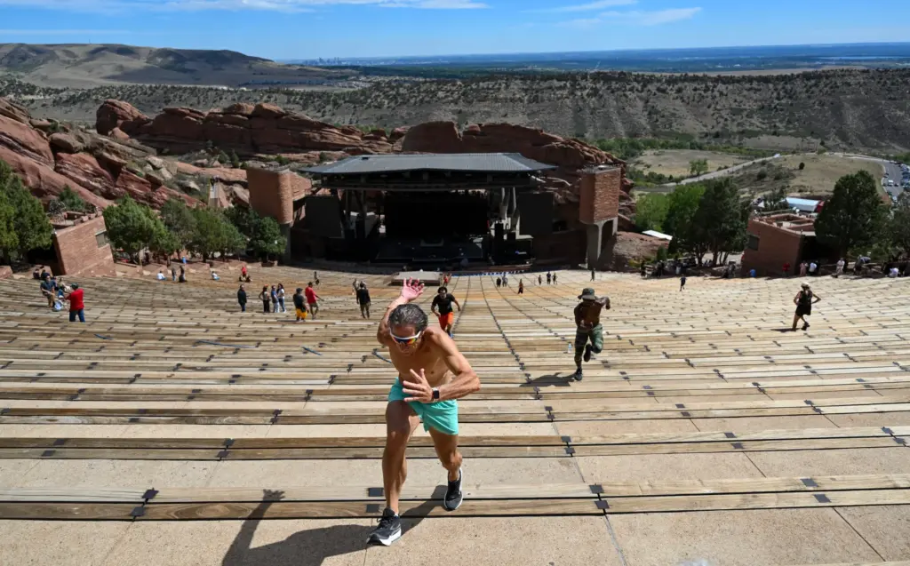 Nick Palgrave runs up the seats in the amphitheater at...