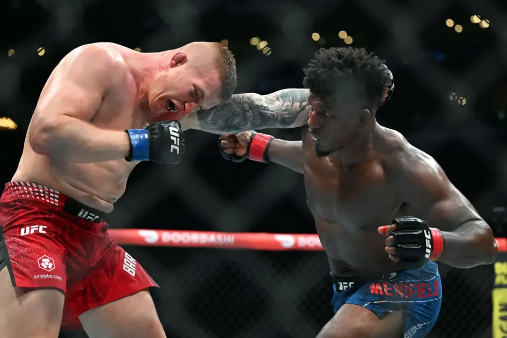 Alonzo Menifield (red) vs. Iwo Baraniewski (blue) during their fight...