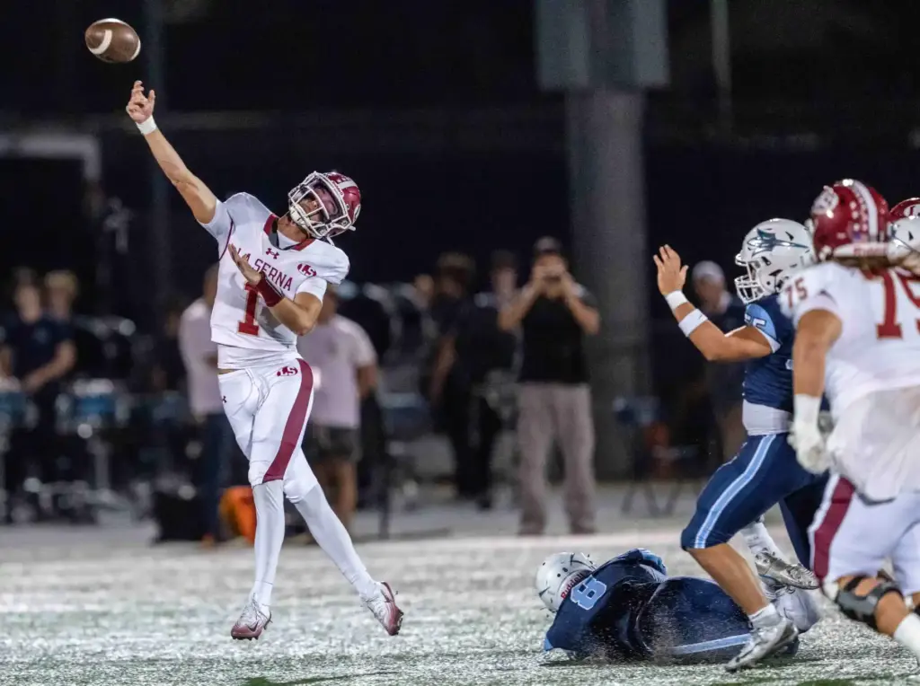 La Serna quarterback Grady Long (1) throws the ball while...