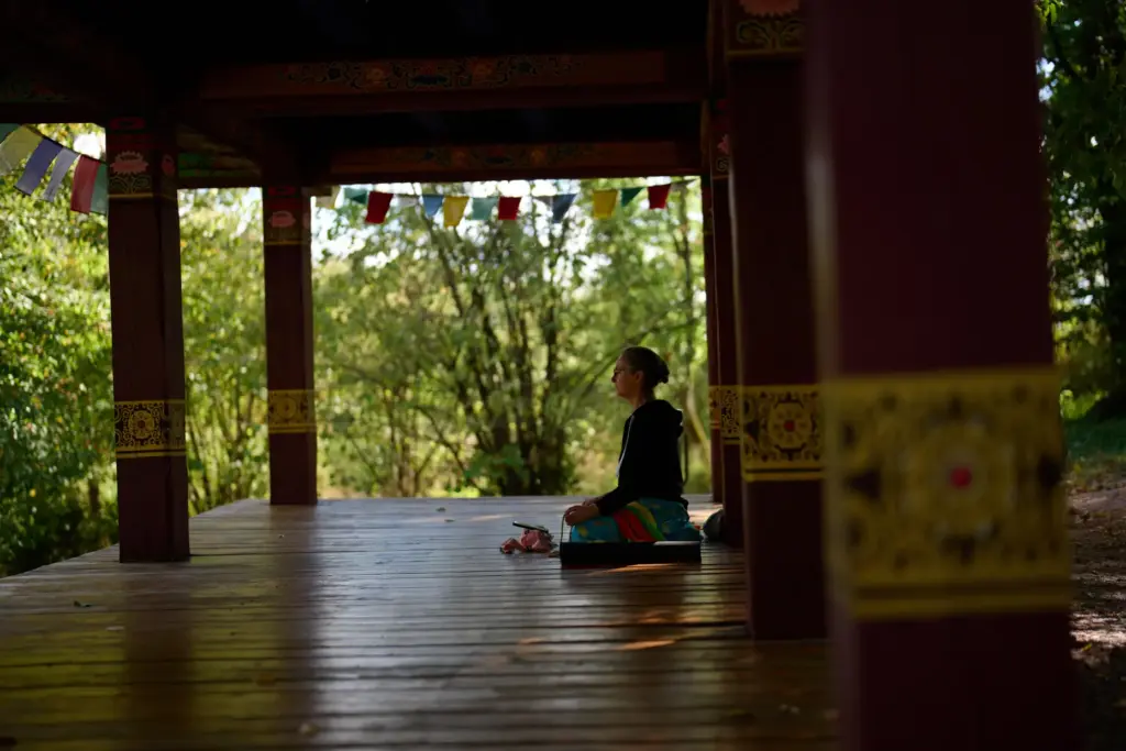 Tetyana Shevchenko meditates in the botanical gardens during an air raid alarm in Kyiv.