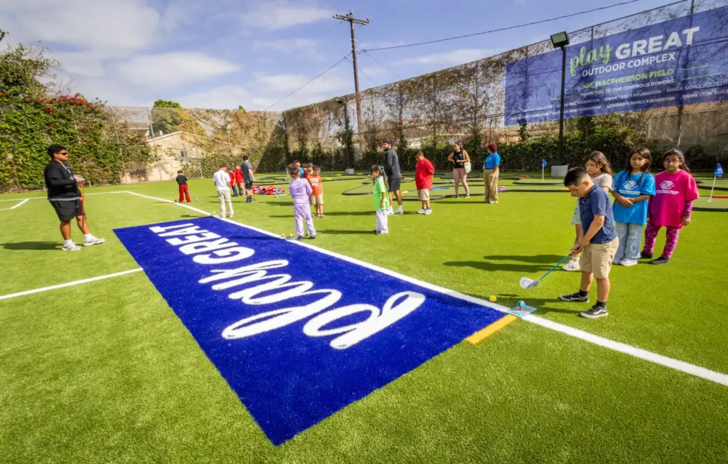 Children practice their golf skills after school at the recently...