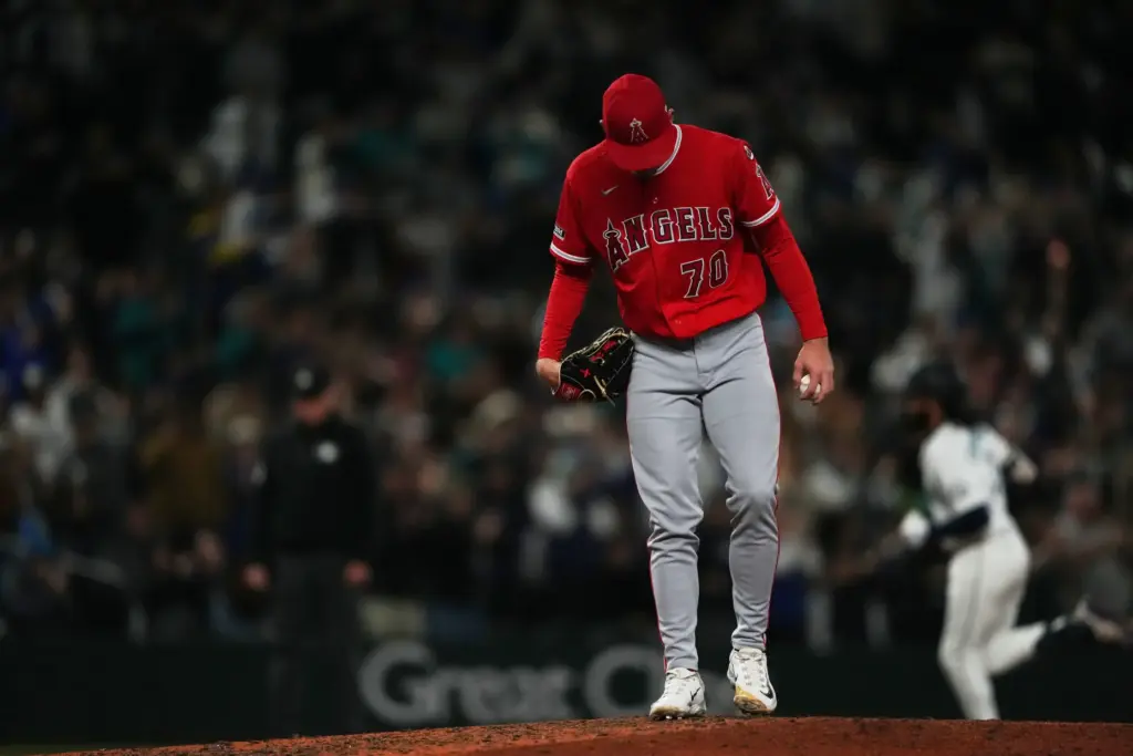 Angels relief pitcher Mitch Farris looks down as Seattle Mariners’...