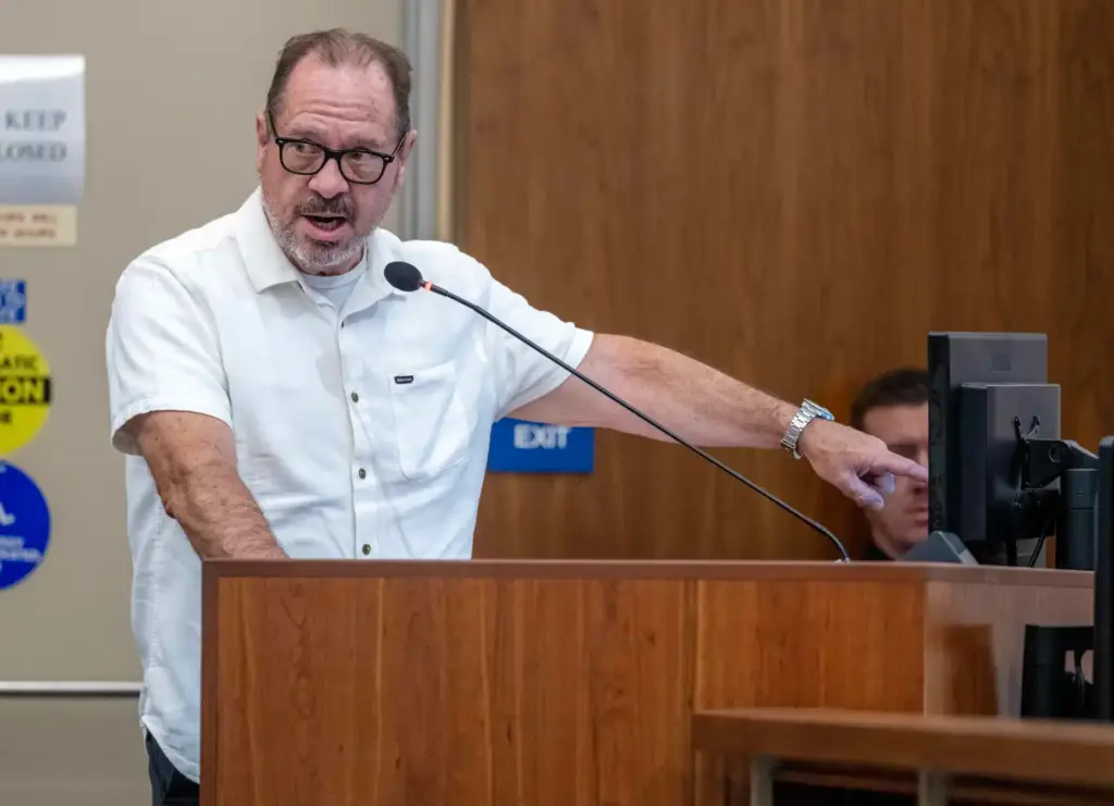 Costa Mesa resident Walter Reece urges city council members to...