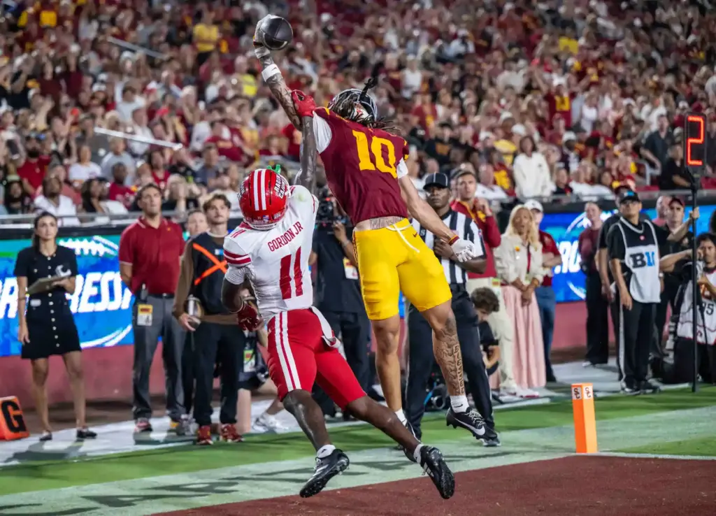 USC wide receiver Corey Simms (10), right, has a would-be...