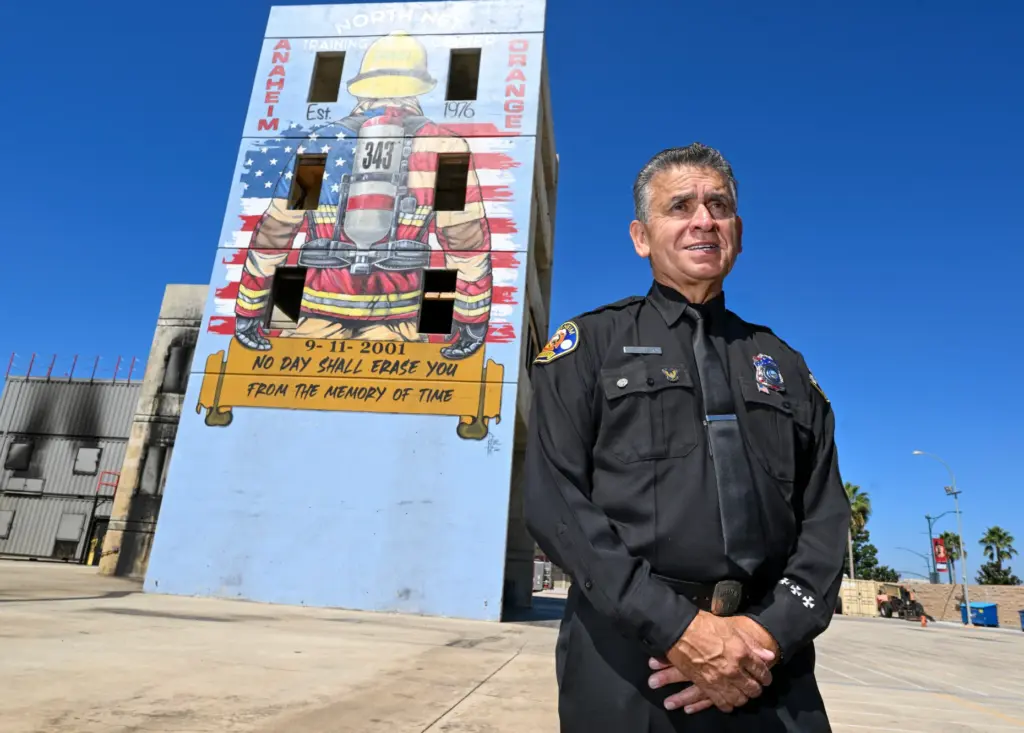 Retired firefighter Fernando Negrete near muralist Rosie Tosâ 9/11 fighter...