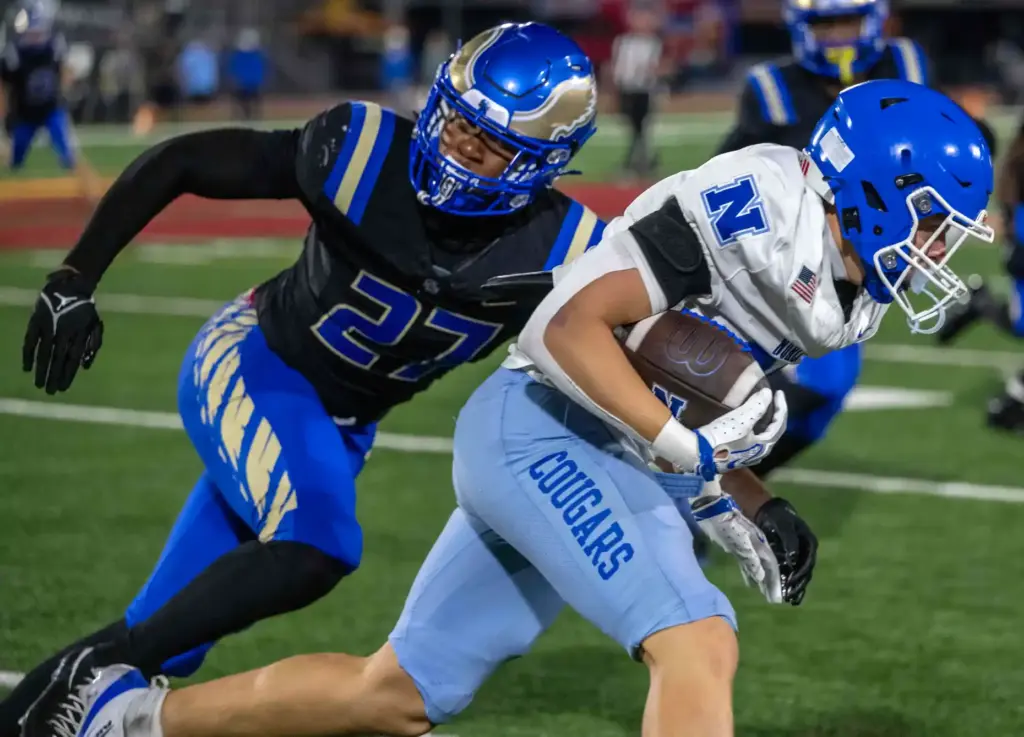 Norco running back Dylan Troelstrup (21) carries the ball during...