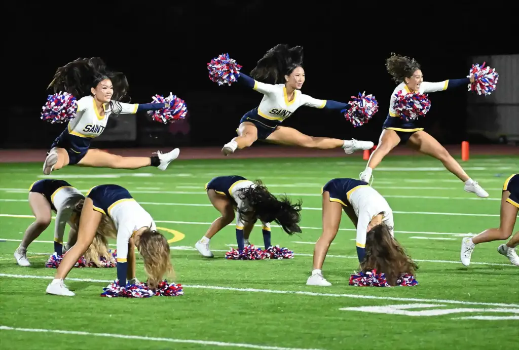 Crean Lutheranâs Cheer squad entertains the crowd during their halftime...