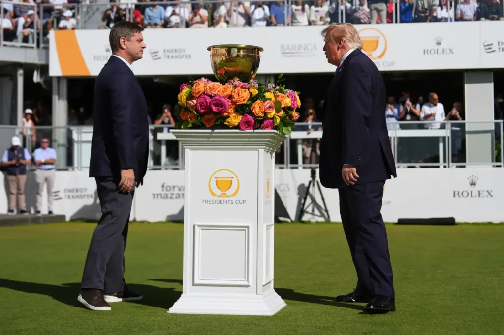 President Donald Trump, right, speaks with PGA Tour CEO Brian...