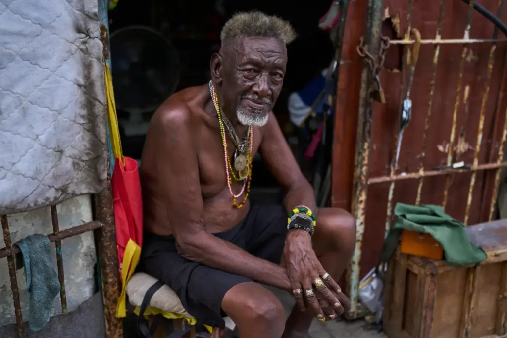 Oscar JoaquÃ­n LÃ³pez poses for a photo at the entrance of his home in Havana, Cuba.