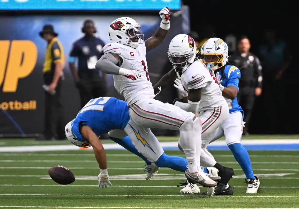 Arizona Cardinals linebacker Mack Wilson Sr. (1) knocks away a...