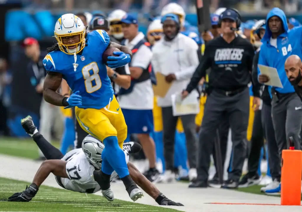 Chargers running back Omarion Hampton (8) carries the ball during...
