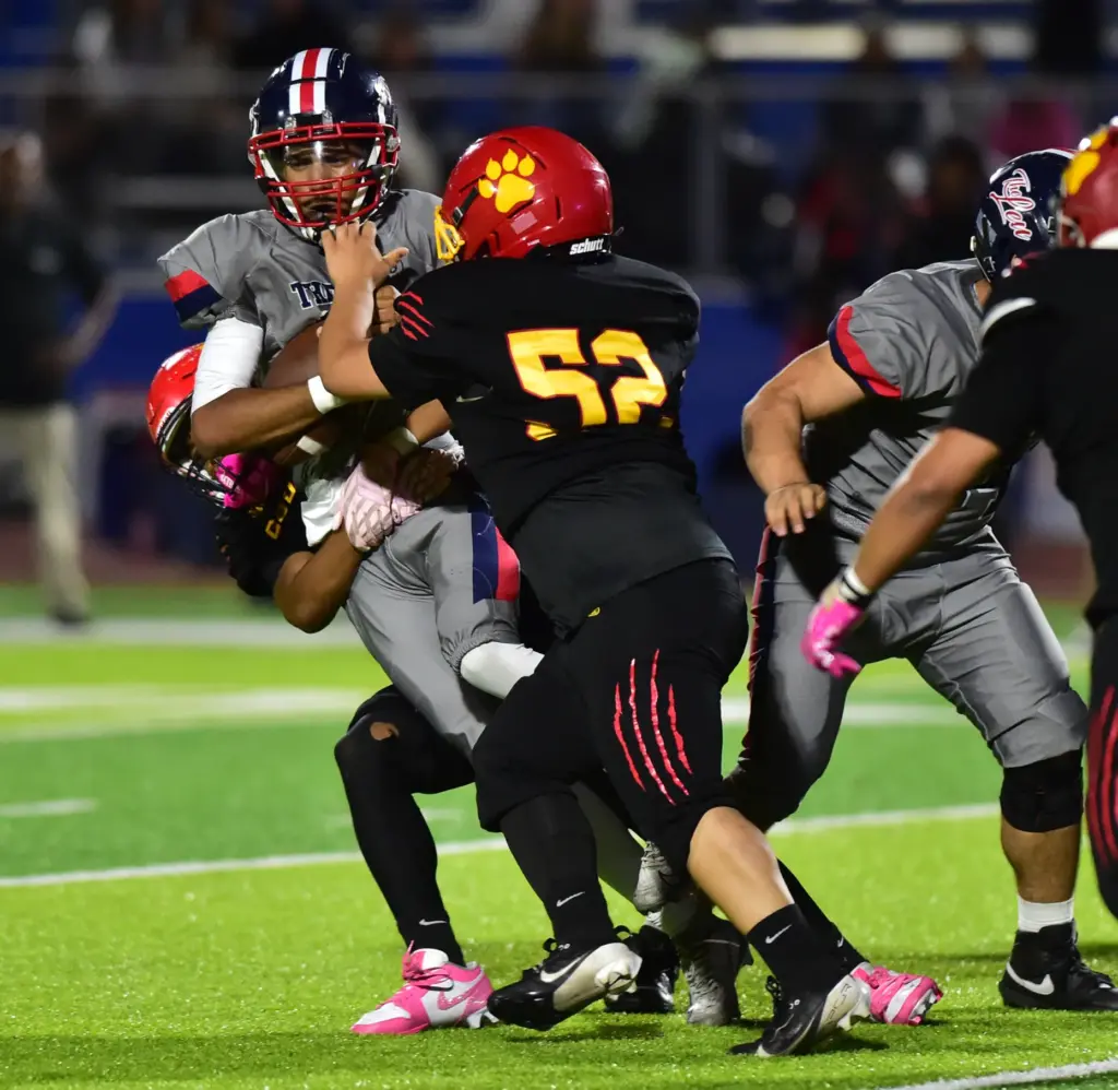 Leuzinger QB Max Leyva gets sacked by Hawthorne defense in...