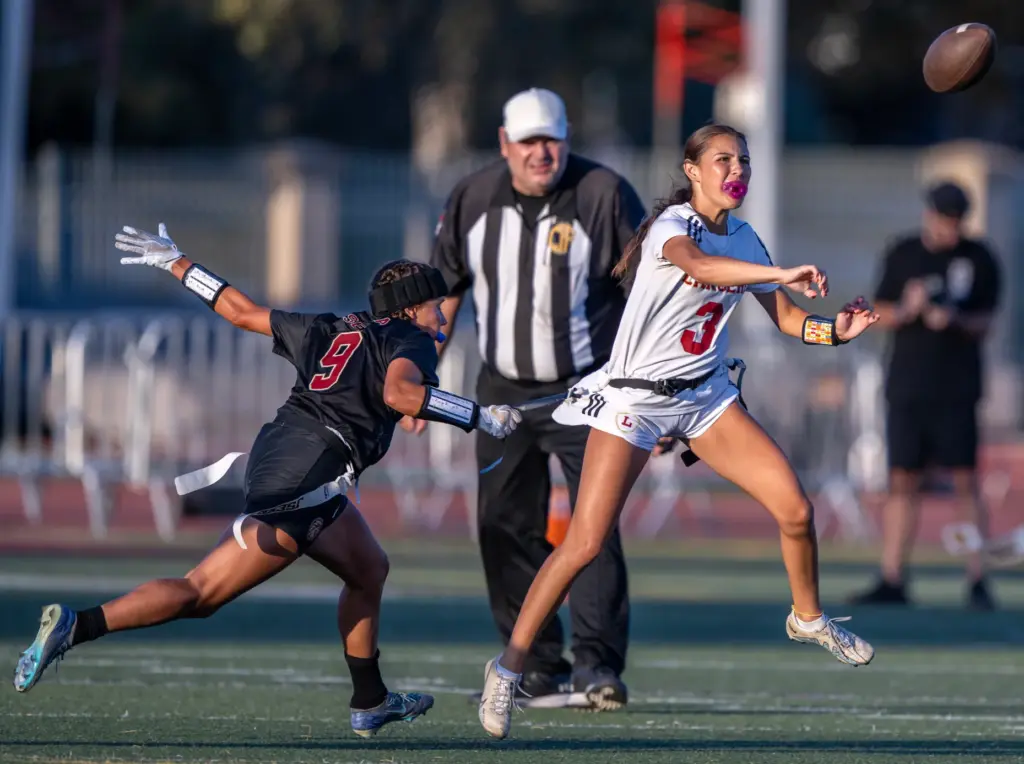 Orange Lutheran quarterback Alyssa McClure (3) throws the ball before...