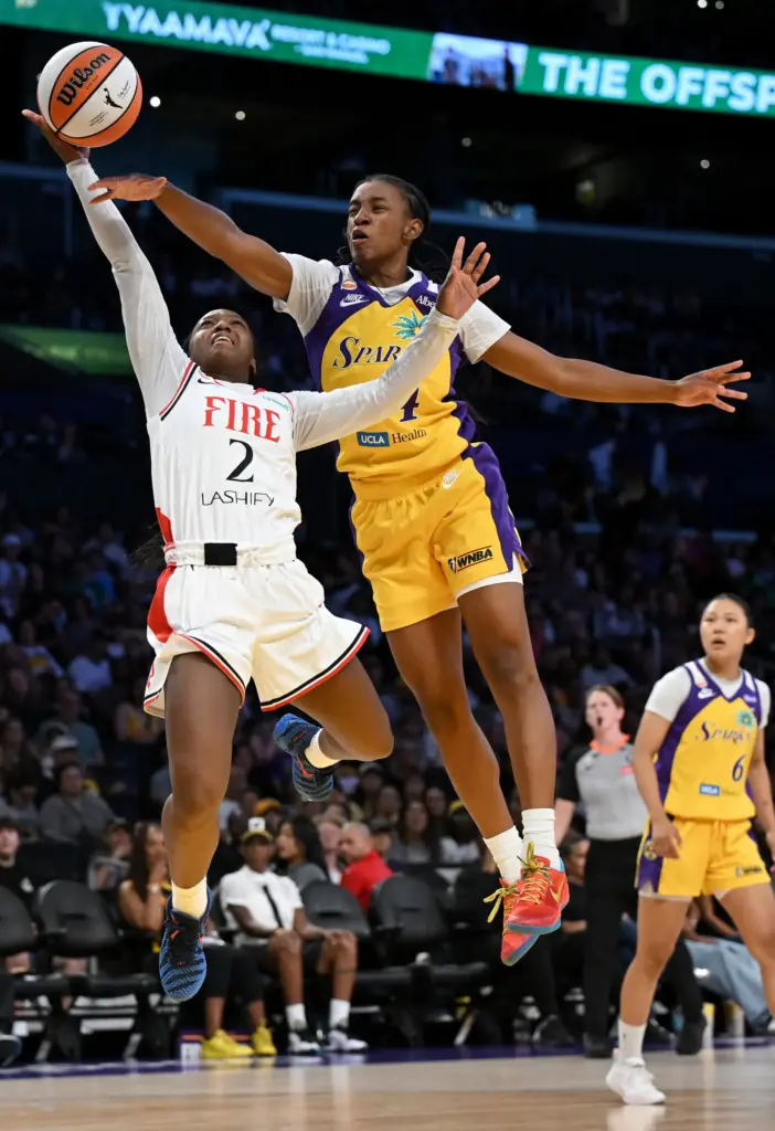 Tonie Morgan #4 of the Los Angeles Sparks blocks a...