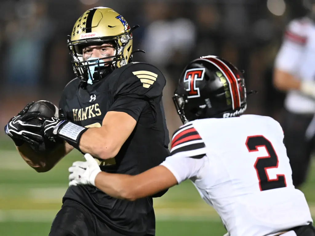 Luke Tucker #12 of El Dorado catches a pass in...
