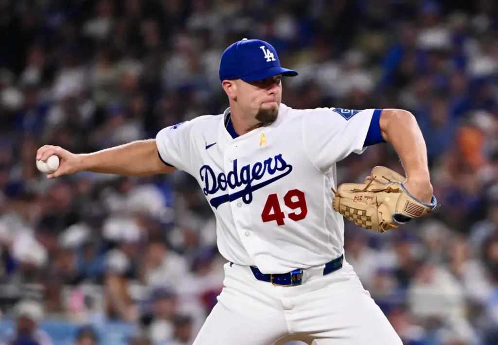 Dodgers relief pitcher Blake Treinen delivers a pitch against the...