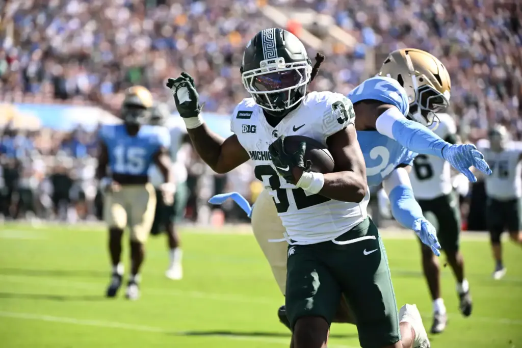 Michigan State running back Kenneth Williams (32) runs past UCLA...
