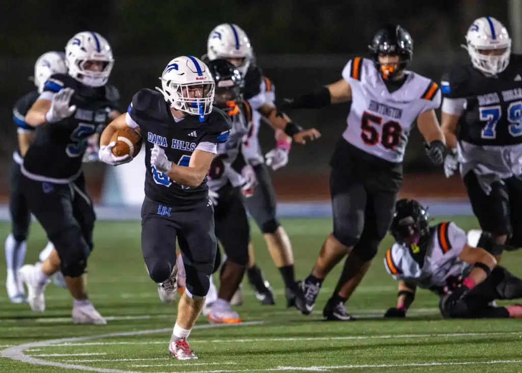 Dana Hills running back Enzo Gallo (84) carries the ball...