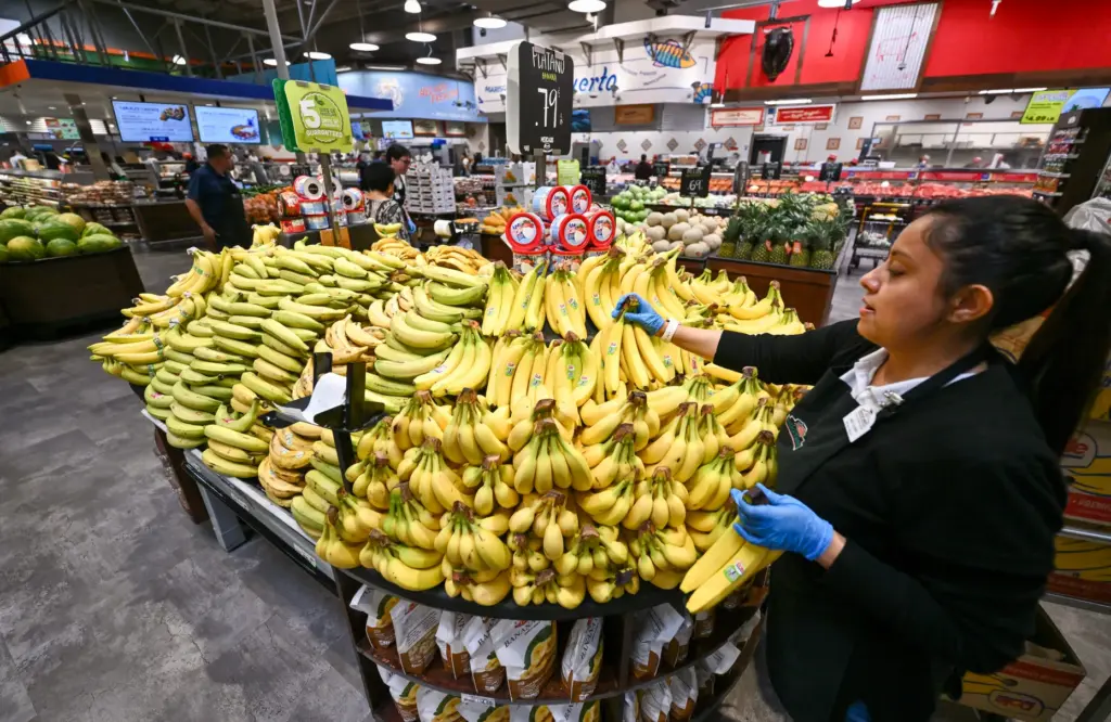 Janet Guzman stacks bananas during opening day of Mercado GonzÃ¡lez...