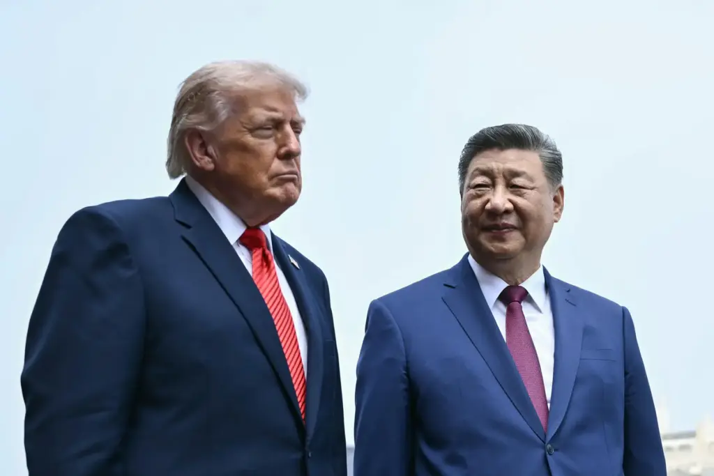 FILE – China’s President Xi Jinping, right, and U.S. President...