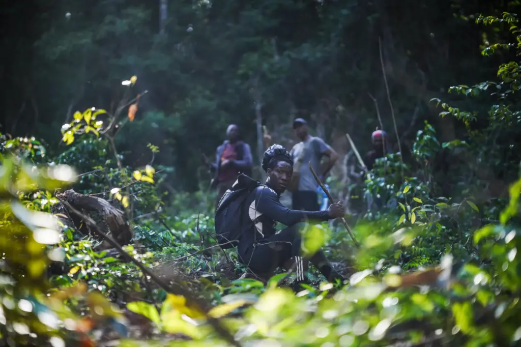 Dennis Adipi, a member of the Saamaka community, patrols in...