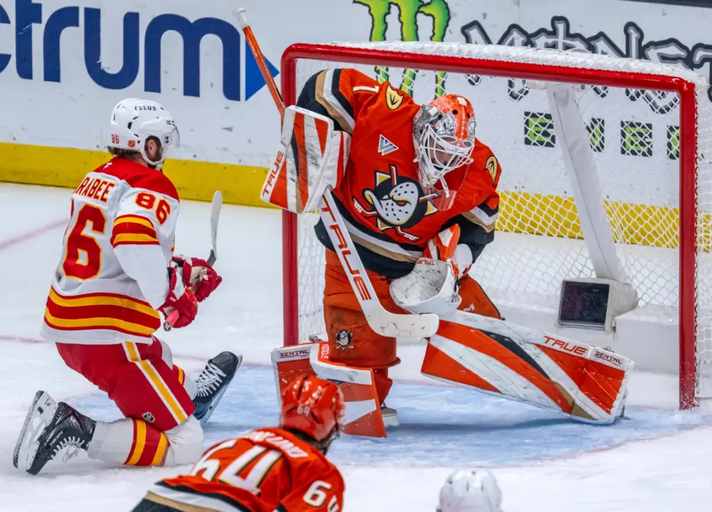 Ducks goaltender Lukas Dostal, right, blocks a shot by the...