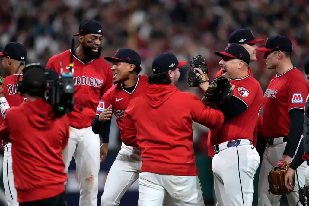 Cleveland Guardians players celebrate after Game 5 of baseball’s American...