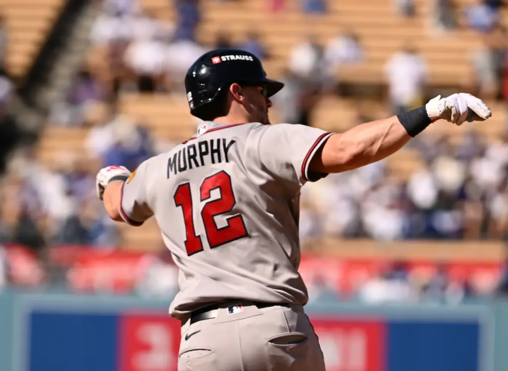 The Atlanta Braves’ Sean Murphy gestures as he runs the...