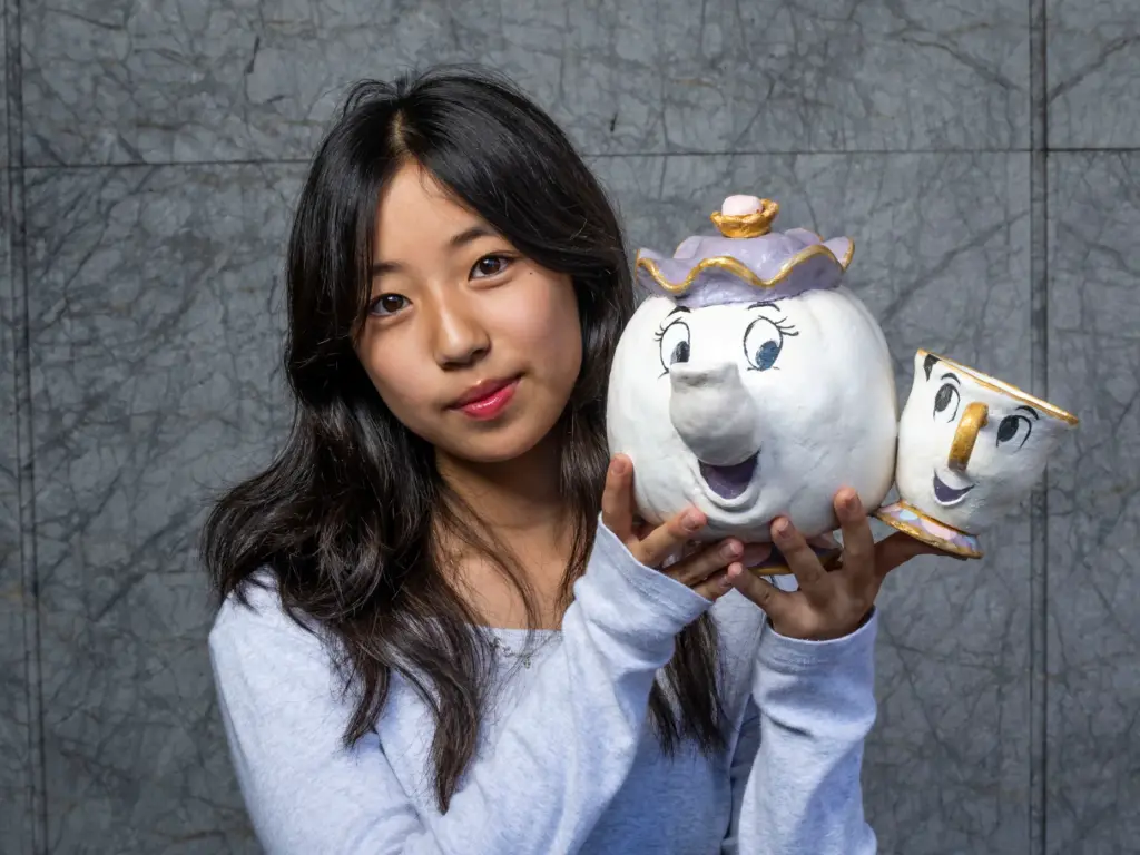 Erika Song holds her pumpkin titled âMrs. Potts and Chipâ...