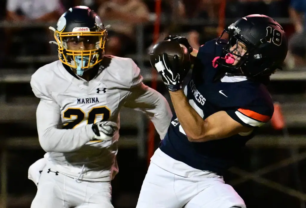 Matt Rodriguez #18 of Cypress catches a TD pass in...