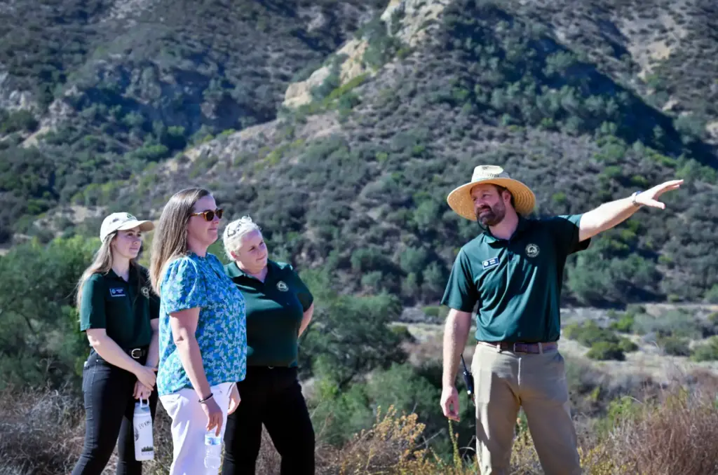 Mark Atkinson, far right, gives a small tour of what...