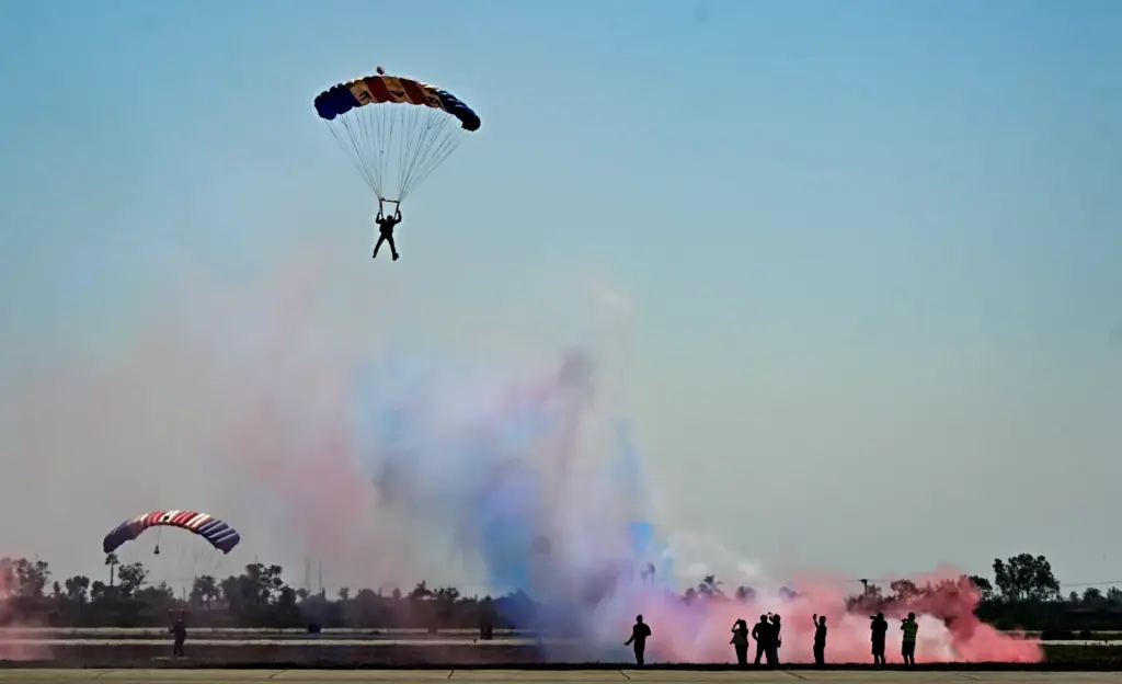 The Royal Air Force Falcons parachute team jump over the...
